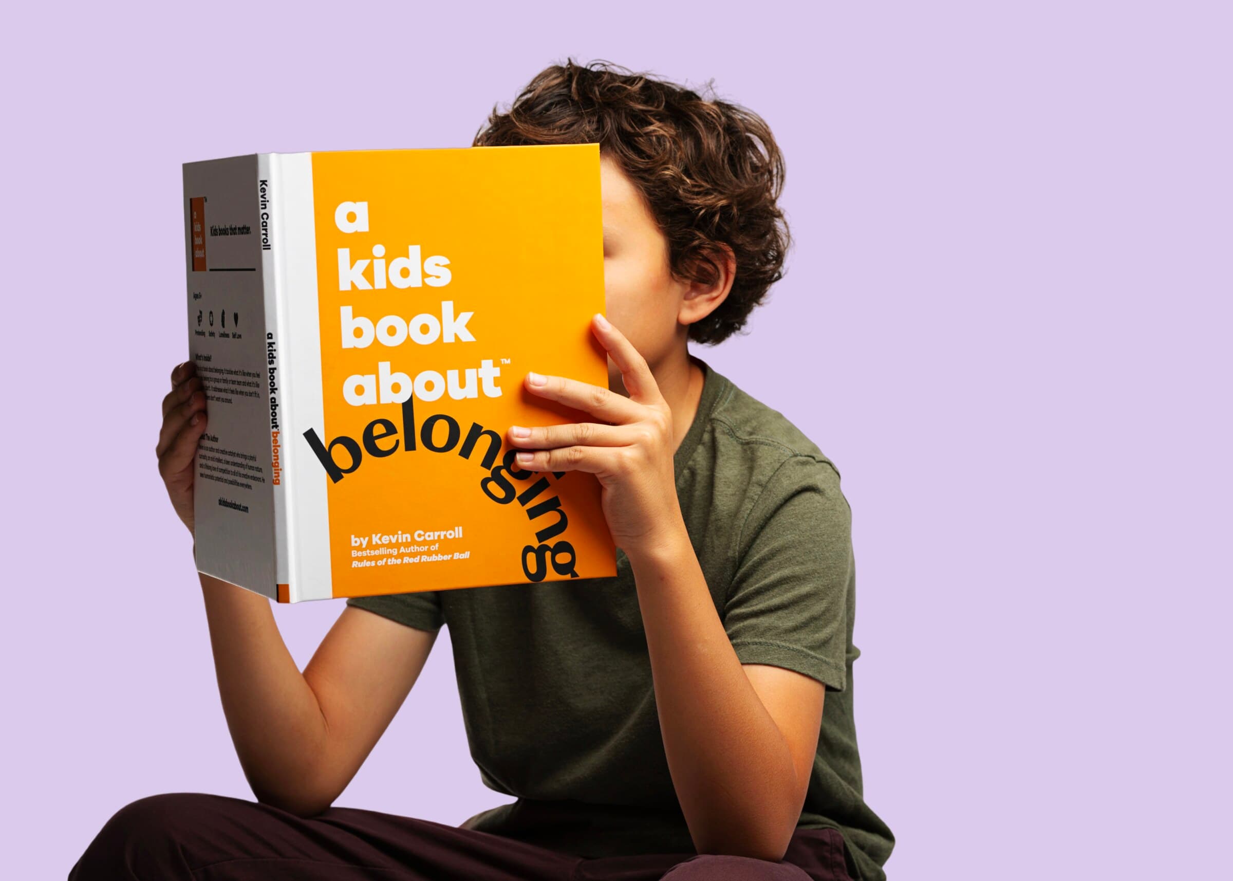 A child reading A Kids Book About Belonging