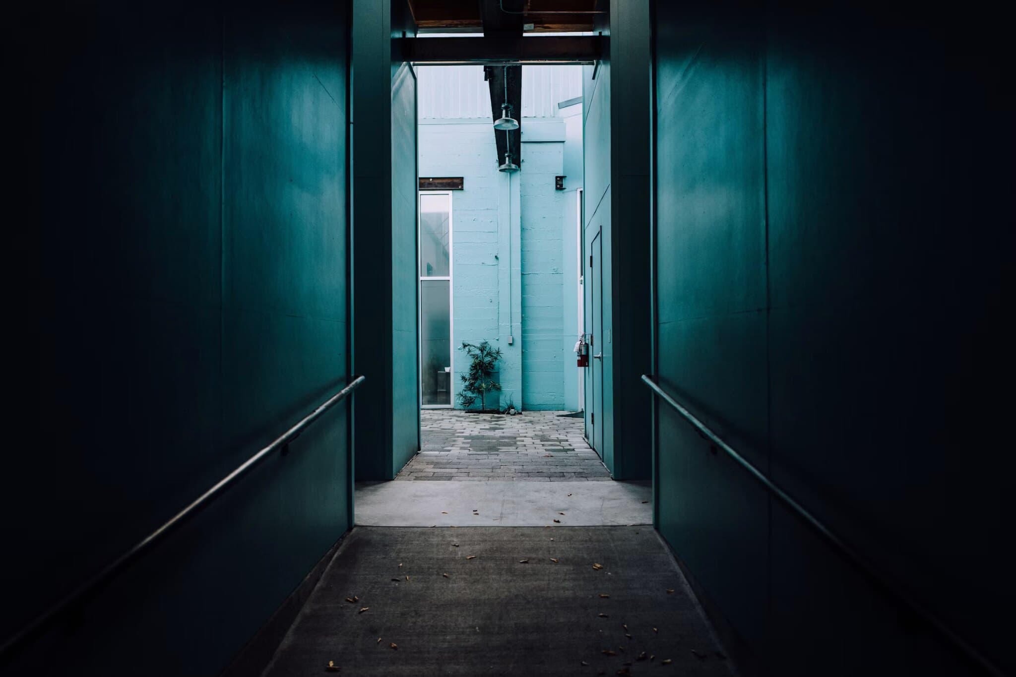 Curved teal corridor